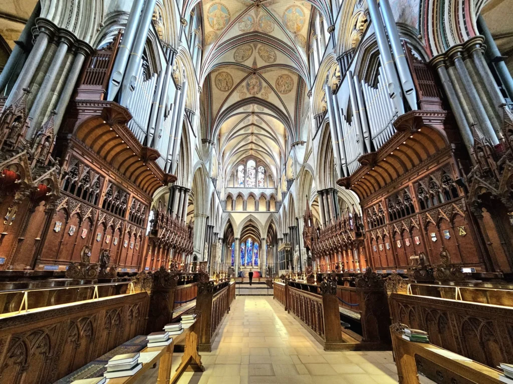 Cruising with Danny and Peter, MSC Cruises, MSC Preziosa, Southamton, London, England, United Kingdom, Stonehenge & Salisbury Tour, A breathtaking view of the Ancient Stone Circle at Stonehenge, showcasing its massive standing stones against the backdrop of the Wiltshire Countryside Trip. Visitors exploring this iconic Neolithic Monument Visit, a renowned UNESCO Heritage Site, as part of the MSC Preziosa Stonehenge and Salisbury Excursion. The towering spire of Salisbury Cathedral, the highlight of the Salisbury Cathedral Tour, stands majestically, housing the historic Magna Carta Exhibit. A scenic drive through the charming English villages on the English Countryside Tour, leading to a fascinating Medieval Town Exploration in Salisbury. This Southampton Shore Excursion offers an unforgettable journey through Historic England Landmarks, blending ancient wonders with medieval splendor.