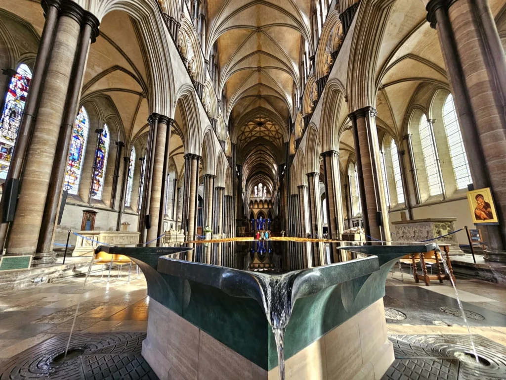 Cruising with Danny and Peter, MSC Cruises, MSC Preziosa, Southamton, London, England, United Kingdom, Stonehenge & Salisbury Tour, A breathtaking view of the Ancient Stone Circle at Stonehenge, showcasing its massive standing stones against the backdrop of the Wiltshire Countryside Trip. Visitors exploring this iconic Neolithic Monument Visit, a renowned UNESCO Heritage Site, as part of the MSC Preziosa Stonehenge and Salisbury Excursion. The towering spire of Salisbury Cathedral, the highlight of the Salisbury Cathedral Tour, stands majestically, housing the historic Magna Carta Exhibit. A scenic drive through the charming English villages on the English Countryside Tour, leading to a fascinating Medieval Town Exploration in Salisbury. This Southampton Shore Excursion offers an unforgettable journey through Historic England Landmarks, blending ancient wonders with medieval splendor.