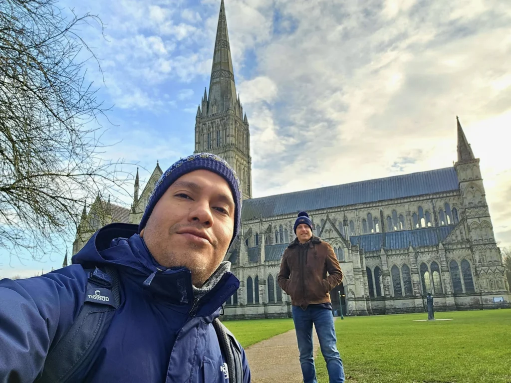 Cruising with Danny and Peter, MSC Cruises, MSC Preziosa, Southamton, London, England, United Kingdom, Stonehenge & Salisbury Tour, A breathtaking view of the Ancient Stone Circle at Stonehenge, showcasing its massive standing stones against the backdrop of the Wiltshire Countryside Trip. Visitors exploring this iconic Neolithic Monument Visit, a renowned UNESCO Heritage Site, as part of the MSC Preziosa Stonehenge and Salisbury Excursion. The towering spire of Salisbury Cathedral, the highlight of the Salisbury Cathedral Tour, stands majestically, housing the historic Magna Carta Exhibit. A scenic drive through the charming English villages on the English Countryside Tour, leading to a fascinating Medieval Town Exploration in Salisbury. This Southampton Shore Excursion offers an unforgettable journey through Historic England Landmarks, blending ancient wonders with medieval splendor.