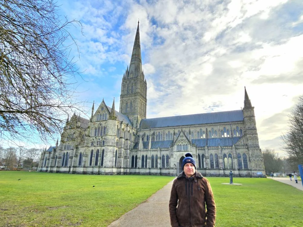 Cruising with Danny and Peter, MSC Cruises, MSC Preziosa, Southamton, London, England, United Kingdom, Stonehenge & Salisbury Tour, A breathtaking view of the Ancient Stone Circle at Stonehenge, showcasing its massive standing stones against the backdrop of the Wiltshire Countryside Trip. Visitors exploring this iconic Neolithic Monument Visit, a renowned UNESCO Heritage Site, as part of the MSC Preziosa Stonehenge and Salisbury Excursion. The towering spire of Salisbury Cathedral, the highlight of the Salisbury Cathedral Tour, stands majestically, housing the historic Magna Carta Exhibit. A scenic drive through the charming English villages on the English Countryside Tour, leading to a fascinating Medieval Town Exploration in Salisbury. This Southampton Shore Excursion offers an unforgettable journey through Historic England Landmarks, blending ancient wonders with medieval splendor.