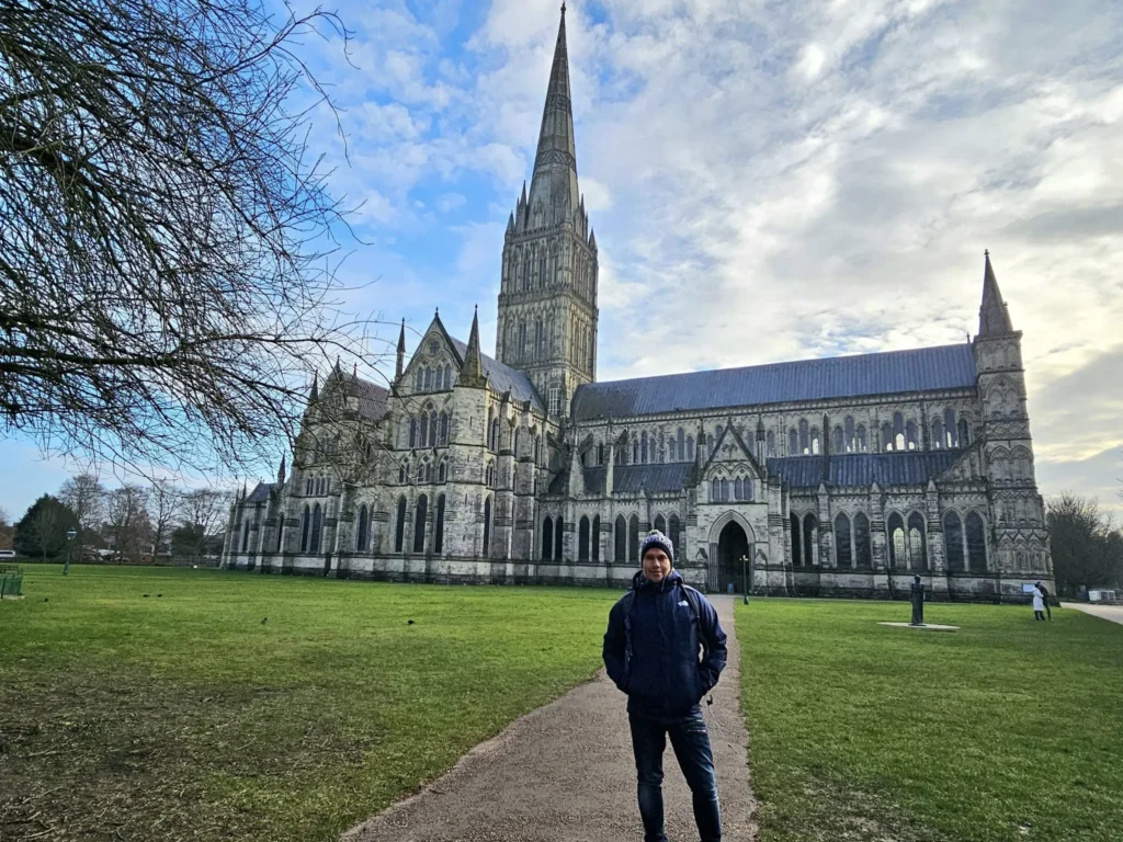 Cruising with Danny and Peter, MSC Cruises, MSC Preziosa, Southamton, London, England, United Kingdom, Stonehenge & Salisbury Tour, A breathtaking view of the Ancient Stone Circle at Stonehenge, showcasing its massive standing stones against the backdrop of the Wiltshire Countryside Trip. Visitors exploring this iconic Neolithic Monument Visit, a renowned UNESCO Heritage Site, as part of the MSC Preziosa Stonehenge and Salisbury Excursion. The towering spire of Salisbury Cathedral, the highlight of the Salisbury Cathedral Tour, stands majestically, housing the historic Magna Carta Exhibit. A scenic drive through the charming English villages on the English Countryside Tour, leading to a fascinating Medieval Town Exploration in Salisbury. This Southampton Shore Excursion offers an unforgettable journey through Historic England Landmarks, blending ancient wonders with medieval splendor.