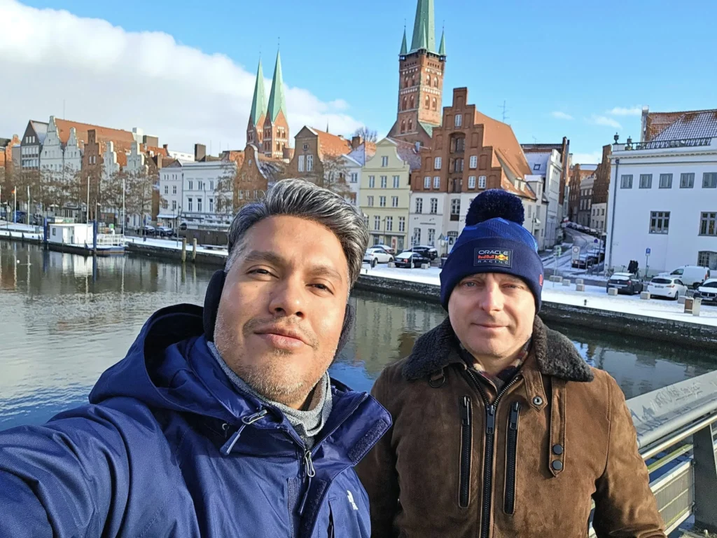 Cruising with Danny and Peter, MSC Cruises, MSC Preziosa, Hamburg, Germany, Lubeck City Tour showcasing the Holsten Gate, a historic medieval landmark with iconic round towers; St. Mary’s Church, known for its Gothic architecture and the world’s largest mechanical organ; charming cobblestone streets and UNESCO Heritage sites of Lubeck, reflecting its Hanseatic League history; traditional German lunch featuring bratwurst, sauerkraut, pretzels, and Lubeck’s famous marzipan, offering a taste of the city’s cultural and culinary heritage.