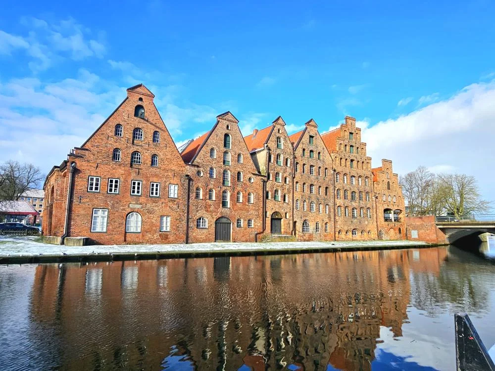 Cruising with Danny and Peter, MSC Cruises, MSC Preziosa, Hamburg, Germany, Lubeck City Tour showcasing the Holsten Gate, a historic medieval landmark with iconic round towers; St. Mary’s Church, known for its Gothic architecture and the world’s largest mechanical organ; charming cobblestone streets and UNESCO Heritage sites of Lubeck, reflecting its Hanseatic League history; traditional German lunch featuring bratwurst, sauerkraut, pretzels, and Lubeck’s famous marzipan, offering a taste of the city’s cultural and culinary heritage.
