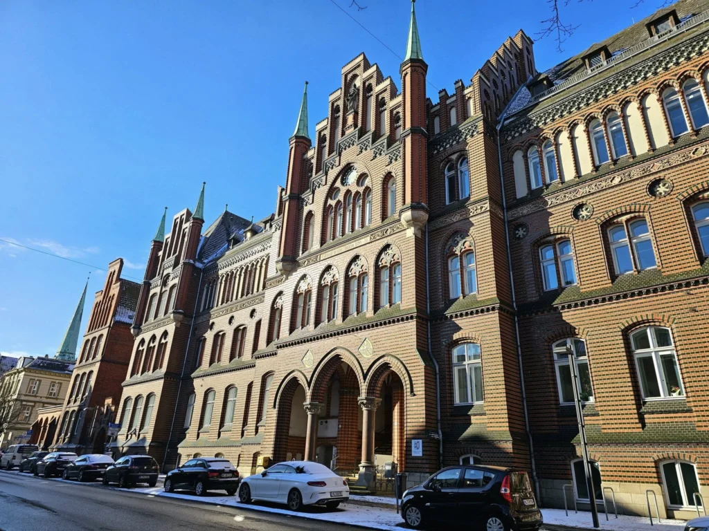 Cruising with Danny and Peter, MSC Cruises, MSC Preziosa, Hamburg, Germany, Lubeck City Tour showcasing the Holsten Gate, a historic medieval landmark with iconic round towers; St. Mary’s Church, known for its Gothic architecture and the world’s largest mechanical organ; charming cobblestone streets and UNESCO Heritage sites of Lubeck, reflecting its Hanseatic League history; traditional German lunch featuring bratwurst, sauerkraut, pretzels, and Lubeck’s famous marzipan, offering a taste of the city’s cultural and culinary heritage.