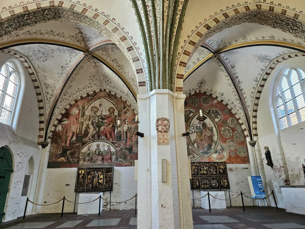 Cruising with Danny and Peter, MSC Cruises, MSC Preziosa, Hamburg, Germany, Lubeck City Tour showcasing the Holsten Gate, a historic medieval landmark with iconic round towers; St. Mary’s Church, known for its Gothic architecture and the world’s largest mechanical organ; charming cobblestone streets and UNESCO Heritage sites of Lubeck, reflecting its Hanseatic League history; traditional German lunch featuring bratwurst, sauerkraut, pretzels, and Lubeck’s famous marzipan, offering a taste of the city’s cultural and culinary heritage.