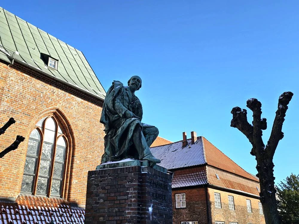 Cruising with Danny and Peter, MSC Cruises, MSC Preziosa, Hamburg, Germany, Lubeck City Tour showcasing the Holsten Gate, a historic medieval landmark with iconic round towers; St. Mary’s Church, known for its Gothic architecture and the world’s largest mechanical organ; charming cobblestone streets and UNESCO Heritage sites of Lubeck, reflecting its Hanseatic League history; traditional German lunch featuring bratwurst, sauerkraut, pretzels, and Lubeck’s famous marzipan, offering a taste of the city’s cultural and culinary heritage.