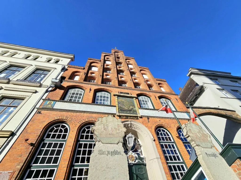 Cruising with Danny and Peter, MSC Cruises, MSC Preziosa, Hamburg, Germany, Lubeck City Tour showcasing the Holsten Gate, a historic medieval landmark with iconic round towers; St. Mary’s Church, known for its Gothic architecture and the world’s largest mechanical organ; charming cobblestone streets and UNESCO Heritage sites of Lubeck, reflecting its Hanseatic League history; traditional German lunch featuring bratwurst, sauerkraut, pretzels, and Lubeck’s famous marzipan, offering a taste of the city’s cultural and culinary heritage.