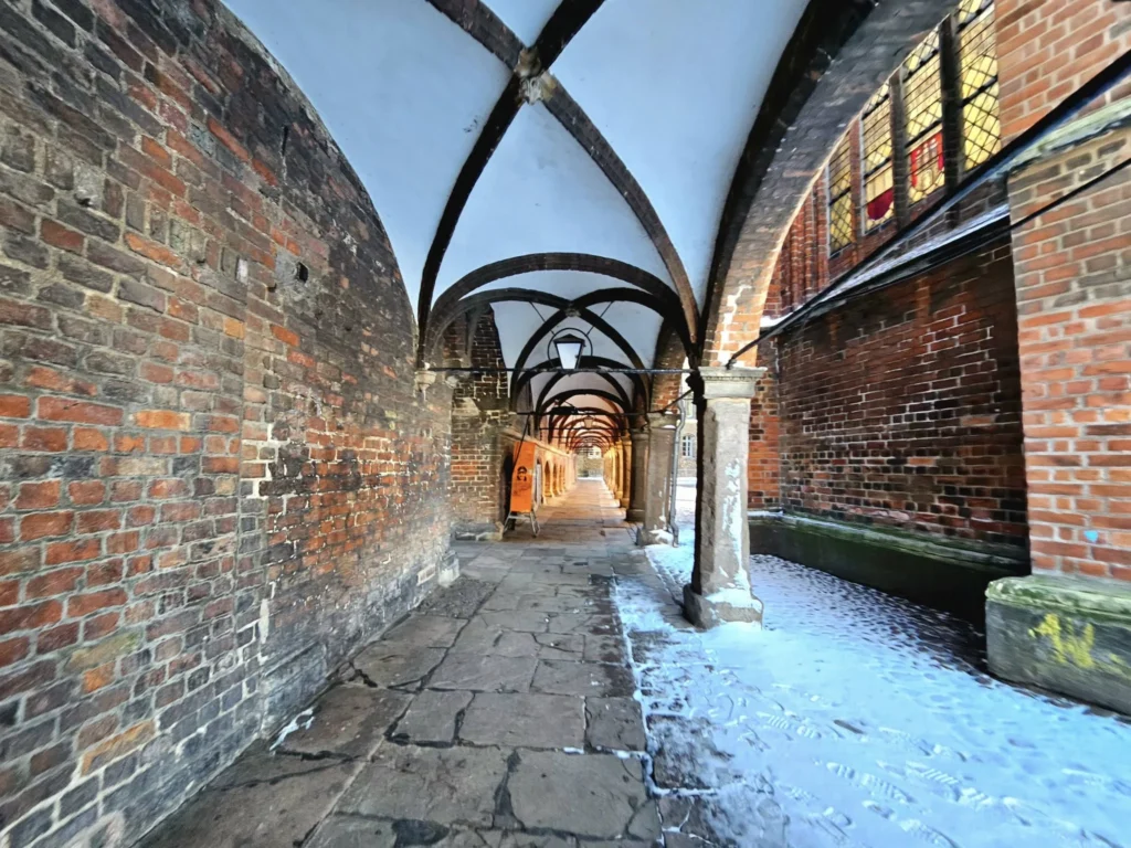 Cruising with Danny and Peter, MSC Cruises, MSC Preziosa, Hamburg, Germany, Lubeck City Tour showcasing the Holsten Gate, a historic medieval landmark with iconic round towers; St. Mary’s Church, known for its Gothic architecture and the world’s largest mechanical organ; charming cobblestone streets and UNESCO Heritage sites of Lubeck, reflecting its Hanseatic League history; traditional German lunch featuring bratwurst, sauerkraut, pretzels, and Lubeck’s famous marzipan, offering a taste of the city’s cultural and culinary heritage.