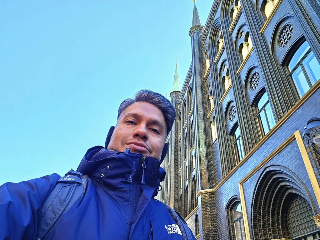 Cruising with Danny and Peter, MSC Cruises, MSC Preziosa, Hamburg, Germany, Lubeck City Tour showcasing the Holsten Gate, a historic medieval landmark with iconic round towers; St. Mary’s Church, known for its Gothic architecture and the world’s largest mechanical organ; charming cobblestone streets and UNESCO Heritage sites of Lubeck, reflecting its Hanseatic League history; traditional German lunch featuring bratwurst, sauerkraut, pretzels, and Lubeck’s famous marzipan, offering a taste of the city’s cultural and culinary heritage.