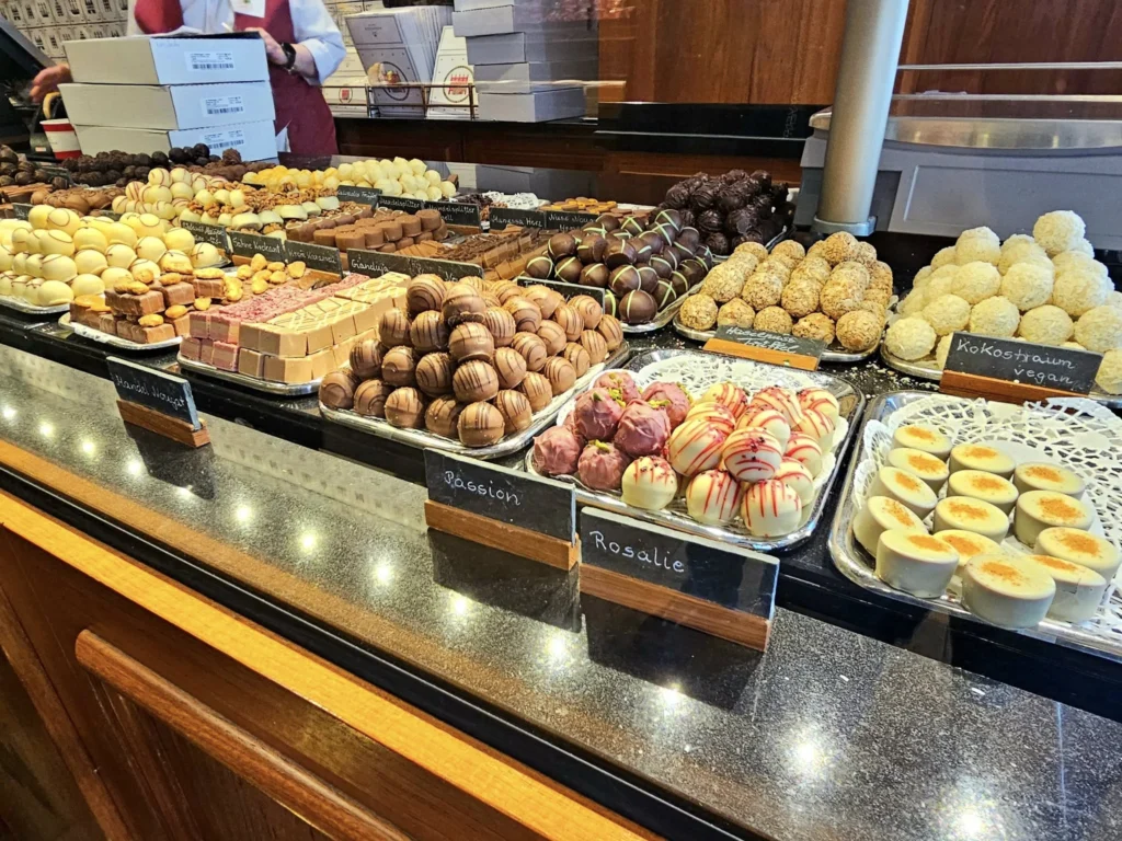 Cruising with Danny and Peter, MSC Cruises, MSC Preziosa, Hamburg, Germany, Lubeck City Tour showcasing the Holsten Gate, a historic medieval landmark with iconic round towers; St. Mary’s Church, known for its Gothic architecture and the world’s largest mechanical organ; charming cobblestone streets and UNESCO Heritage sites of Lubeck, reflecting its Hanseatic League history; traditional German lunch featuring bratwurst, sauerkraut, pretzels, and Lubeck’s famous marzipan, offering a taste of the city’s cultural and culinary heritage.