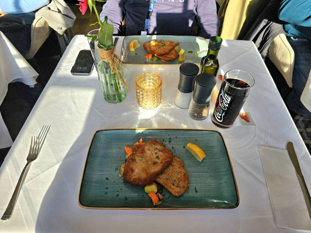 Cruising with Danny and Peter, MSC Cruises, MSC Preziosa, Hamburg, Germany, Lubeck City Tour showcasing the Holsten Gate, a historic medieval landmark with iconic round towers; St. Mary’s Church, known for its Gothic architecture and the world’s largest mechanical organ; charming cobblestone streets and UNESCO Heritage sites of Lubeck, reflecting its Hanseatic League history; traditional German lunch featuring bratwurst, sauerkraut, pretzels, and Lubeck’s famous marzipan, offering a taste of the city’s cultural and culinary heritage.