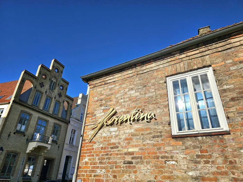 Cruising with Danny and Peter, MSC Cruises, MSC Preziosa, Hamburg, Germany, Lubeck City Tour showcasing the Holsten Gate, a historic medieval landmark with iconic round towers; St. Mary’s Church, known for its Gothic architecture and the world’s largest mechanical organ; charming cobblestone streets and UNESCO Heritage sites of Lubeck, reflecting its Hanseatic League history; traditional German lunch featuring bratwurst, sauerkraut, pretzels, and Lubeck’s famous marzipan, offering a taste of the city’s cultural and culinary heritage.