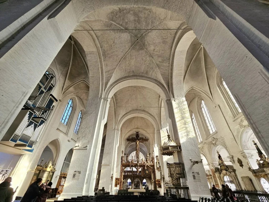 Cruising with Danny and Peter, MSC Cruises, MSC Preziosa, Hamburg, Germany, Lubeck City Tour showcasing the Holsten Gate, a historic medieval landmark with iconic round towers; St. Mary’s Church, known for its Gothic architecture and the world’s largest mechanical organ; charming cobblestone streets and UNESCO Heritage sites of Lubeck, reflecting its Hanseatic League history; traditional German lunch featuring bratwurst, sauerkraut, pretzels, and Lubeck’s famous marzipan, offering a taste of the city’s cultural and culinary heritage.