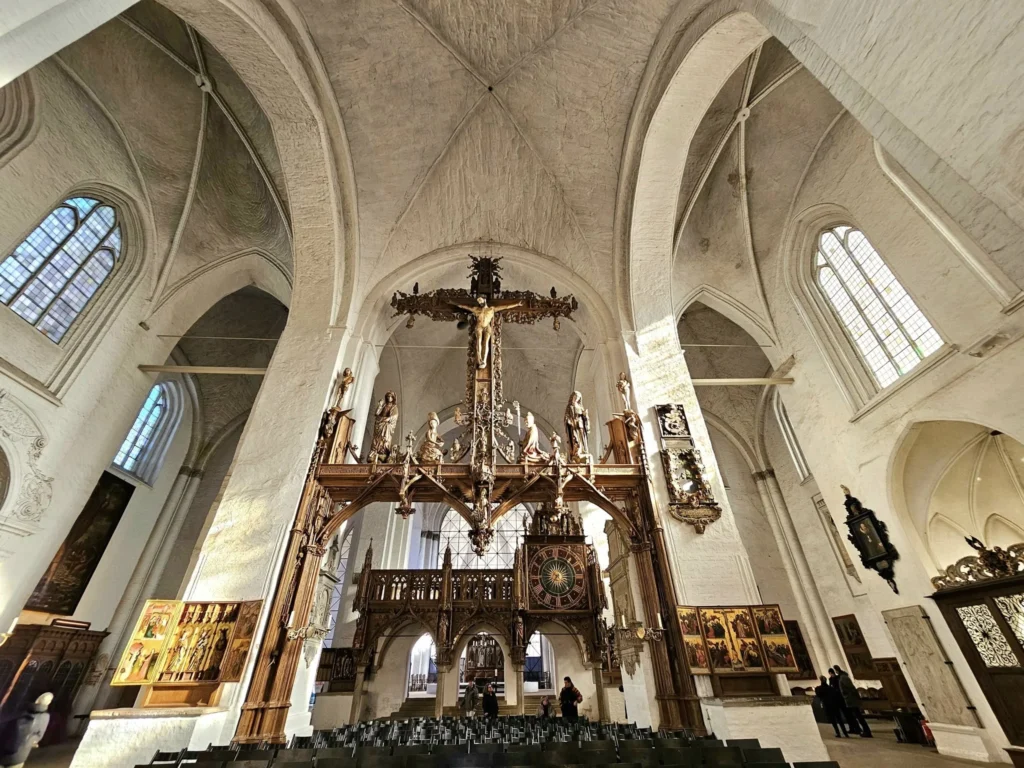 Cruising with Danny and Peter, MSC Cruises, MSC Preziosa, Hamburg, Germany, Lubeck City Tour showcasing the Holsten Gate, a historic medieval landmark with iconic round towers; St. Mary’s Church, known for its Gothic architecture and the world’s largest mechanical organ; charming cobblestone streets and UNESCO Heritage sites of Lubeck, reflecting its Hanseatic League history; traditional German lunch featuring bratwurst, sauerkraut, pretzels, and Lubeck’s famous marzipan, offering a taste of the city’s cultural and culinary heritage.