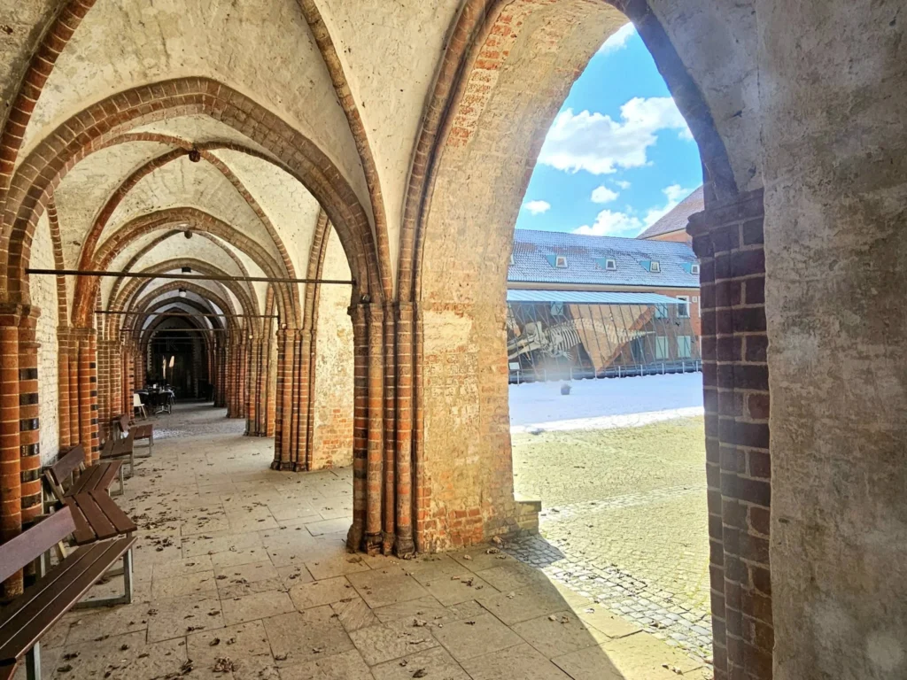 Cruising with Danny and Peter, MSC Cruises, MSC Preziosa, Hamburg, Germany, Lubeck City Tour showcasing the Holsten Gate, a historic medieval landmark with iconic round towers; St. Mary’s Church, known for its Gothic architecture and the world’s largest mechanical organ; charming cobblestone streets and UNESCO Heritage sites of Lubeck, reflecting its Hanseatic League history; traditional German lunch featuring bratwurst, sauerkraut, pretzels, and Lubeck’s famous marzipan, offering a taste of the city’s cultural and culinary heritage.