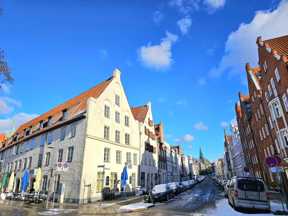 Cruising with Danny and Peter, MSC Cruises, MSC Preziosa, Hamburg, Germany, Lubeck City Tour showcasing the Holsten Gate, a historic medieval landmark with iconic round towers; St. Mary’s Church, known for its Gothic architecture and the world’s largest mechanical organ; charming cobblestone streets and UNESCO Heritage sites of Lubeck, reflecting its Hanseatic League history; traditional German lunch featuring bratwurst, sauerkraut, pretzels, and Lubeck’s famous marzipan, offering a taste of the city’s cultural and culinary heritage.