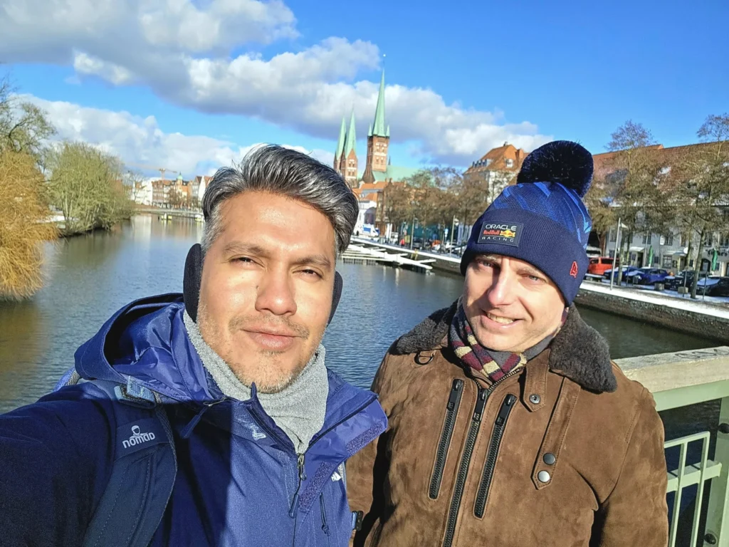 Cruising with Danny and Peter, MSC Cruises, MSC Preziosa, Hamburg, Germany, Lubeck City Tour showcasing the Holsten Gate, a historic medieval landmark with iconic round towers; St. Mary’s Church, known for its Gothic architecture and the world’s largest mechanical organ; charming cobblestone streets and UNESCO Heritage sites of Lubeck, reflecting its Hanseatic League history; traditional German lunch featuring bratwurst, sauerkraut, pretzels, and Lubeck’s famous marzipan, offering a taste of the city’s cultural and culinary heritage.