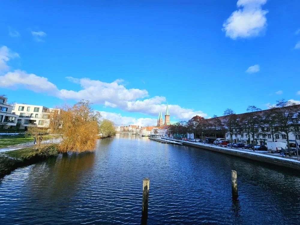 Cruising with Danny and Peter, MSC Cruises, MSC Preziosa, Hamburg, Germany, Lubeck City Tour showcasing the Holsten Gate, a historic medieval landmark with iconic round towers; St. Mary’s Church, known for its Gothic architecture and the world’s largest mechanical organ; charming cobblestone streets and UNESCO Heritage sites of Lubeck, reflecting its Hanseatic League history; traditional German lunch featuring bratwurst, sauerkraut, pretzels, and Lubeck’s famous marzipan, offering a taste of the city’s cultural and culinary heritage.