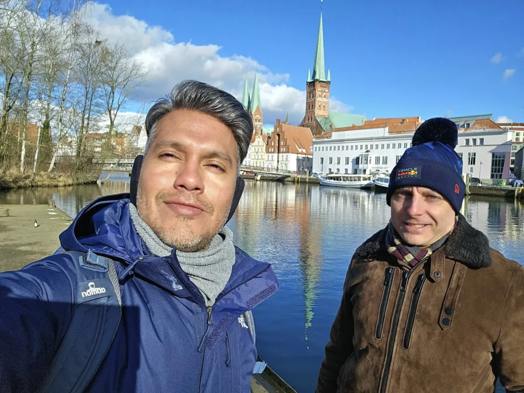 Cruising with Danny and Peter, MSC Cruises, MSC Preziosa, Hamburg, Germany, Lubeck City Tour showcasing the Holsten Gate, a historic medieval landmark with iconic round towers; St. Mary’s Church, known for its Gothic architecture and the world’s largest mechanical organ; charming cobblestone streets and UNESCO Heritage sites of Lubeck, reflecting its Hanseatic League history; traditional German lunch featuring bratwurst, sauerkraut, pretzels, and Lubeck’s famous marzipan, offering a taste of the city’s cultural and culinary heritage.