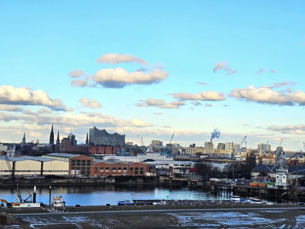 Cruising with Danny and Peter, MSC Cruises, MSC Preziosa, Hamburg, Germany, Lubeck City Tour showcasing the Holsten Gate, a historic medieval landmark with iconic round towers; St. Mary’s Church, known for its Gothic architecture and the world’s largest mechanical organ; charming cobblestone streets and UNESCO Heritage sites of Lubeck, reflecting its Hanseatic League history; traditional German lunch featuring bratwurst, sauerkraut, pretzels, and Lubeck’s famous marzipan, offering a taste of the city’s cultural and culinary heritage.