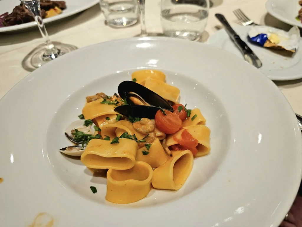 Cruising with Danny and Peter, MSC Cruises, MSC Preziosa, Hamburg, Germany, Lubeck City Tour showcasing the Holsten Gate, a historic medieval landmark with iconic round towers; St. Mary’s Church, known for its Gothic architecture and the world’s largest mechanical organ; charming cobblestone streets and UNESCO Heritage sites of Lubeck, reflecting its Hanseatic League history; traditional German lunch featuring bratwurst, sauerkraut, pretzels, and Lubeck’s famous marzipan, offering a taste of the city’s cultural and culinary heritage.