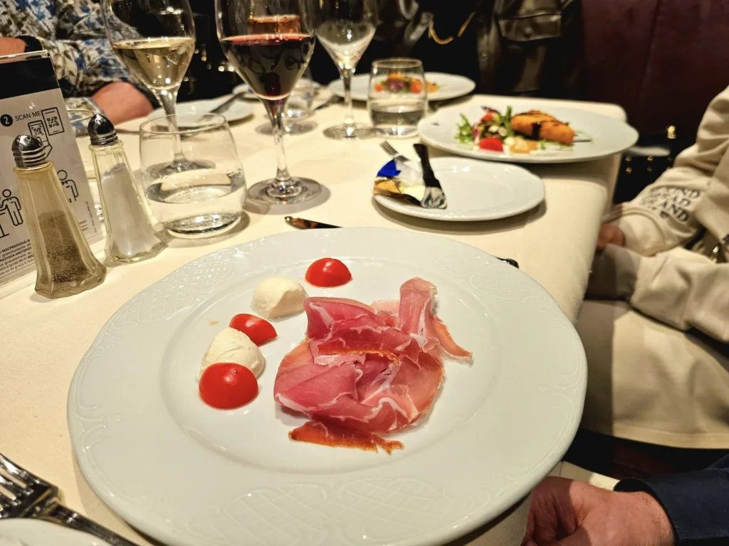 Cruising with Danny and Peter, MSC Cruises, MSC Preziosa, Hamburg, Germany, Lubeck City Tour showcasing the Holsten Gate, a historic medieval landmark with iconic round towers; St. Mary’s Church, known for its Gothic architecture and the world’s largest mechanical organ; charming cobblestone streets and UNESCO Heritage sites of Lubeck, reflecting its Hanseatic League history; traditional German lunch featuring bratwurst, sauerkraut, pretzels, and Lubeck’s famous marzipan, offering a taste of the city’s cultural and culinary heritage.