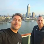 Cruising with Danny and Peter, MSC Cruises, MSC Preziosa, Rotterdam, The Netherlands, Luxury North Sea cruise experience aboard MSC Preziosa, sailing from Hamburg, Germany to Rotterdam, The Netherlands. The journey includes stunning harbor views, vibrant cityscapes, elegant onboard dining, a memorable Gala Dinner at L'Arabesque, world-class entertainment in the Platinum Theatre, and breathtaking final views of Rotterdam’s iconic landmarks like the Erasmus Bridge and SS Rotterdam. Highlights also feature luxurious amenities, scenic North Sea travel, and cultural experiences, offering a truly unforgettable European cruise adventure.