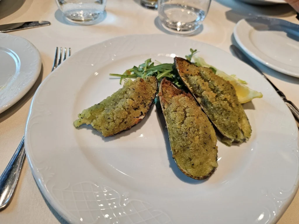 Cruising with Danny and Peter, MSC Cruises, MSC Preziosa, Rotterdam, The Netherlands, Luxury North Sea cruise experience aboard MSC Preziosa, sailing from Hamburg, Germany to Rotterdam, The Netherlands. The journey includes stunning harbor views, vibrant cityscapes, elegant onboard dining, a memorable Gala Dinner at L'Arabesque, world-class entertainment in the Platinum Theatre, and breathtaking final views of Rotterdam’s iconic landmarks like the Erasmus Bridge and SS Rotterdam. Highlights also feature luxurious amenities, scenic North Sea travel, and cultural experiences, offering a truly unforgettable European cruise adventure.