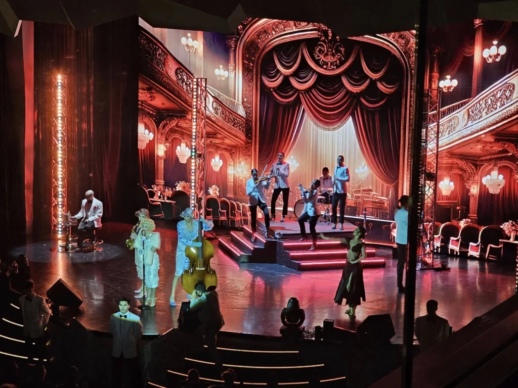 Cruising with Danny and Peter, MSC Cruises, MSC Preziosa, Rotterdam, The Netherlands, Luxury North Sea cruise experience aboard MSC Preziosa, sailing from Hamburg, Germany to Rotterdam, The Netherlands. The journey includes stunning harbor views, vibrant cityscapes, elegant onboard dining, a memorable Gala Dinner at L'Arabesque, world-class entertainment in the Platinum Theatre, and breathtaking final views of Rotterdam’s iconic landmarks like the Erasmus Bridge and SS Rotterdam. Highlights also feature luxurious amenities, scenic North Sea travel, and cultural experiences, offering a truly unforgettable European cruise adventure.