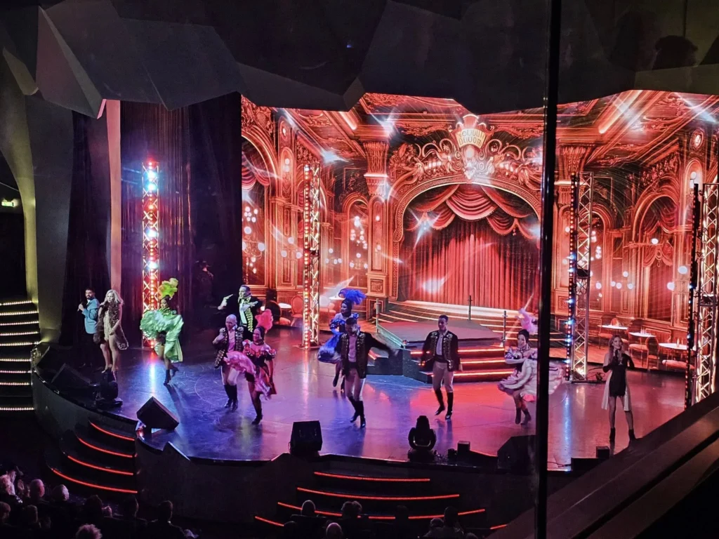 Cruising with Danny and Peter, MSC Cruises, MSC Preziosa, Rotterdam, The Netherlands, Luxury North Sea cruise experience aboard MSC Preziosa, sailing from Hamburg, Germany to Rotterdam, The Netherlands. The journey includes stunning harbor views, vibrant cityscapes, elegant onboard dining, a memorable Gala Dinner at L'Arabesque, world-class entertainment in the Platinum Theatre, and breathtaking final views of Rotterdam’s iconic landmarks like the Erasmus Bridge and SS Rotterdam. Highlights also feature luxurious amenities, scenic North Sea travel, and cultural experiences, offering a truly unforgettable European cruise adventure.