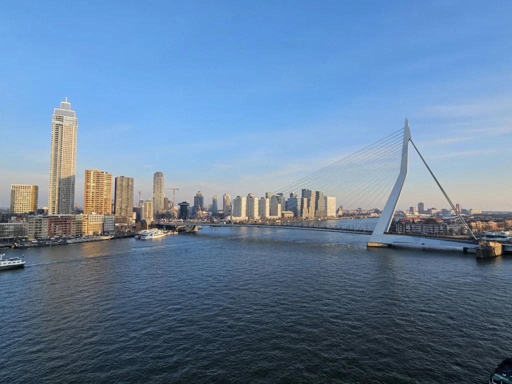 Cruising with Danny and Peter, MSC Cruises, MSC Preziosa, Rotterdam, The Netherlands, Luxury North Sea cruise experience aboard MSC Preziosa, sailing from Hamburg, Germany to Rotterdam, The Netherlands. The journey includes stunning harbor views, vibrant cityscapes, elegant onboard dining, a memorable Gala Dinner at L'Arabesque, world-class entertainment in the Platinum Theatre, and breathtaking final views of Rotterdam’s iconic landmarks like the Erasmus Bridge and SS Rotterdam. Highlights also feature luxurious amenities, scenic North Sea travel, and cultural experiences, offering a truly unforgettable European cruise adventure.