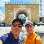 Cruising wiith Danny and Peter, Holland America Line, Nieuw Statendam, La Goulette, Tunis, Tunisia, Exploring Tunisias Cultural Treasures | Nieuw Statendam sails the Mediterranean for Holland America Adventures, docking at La Goulette Port to begin Exploring Tunisia’s Cultural Treasures. Ancient ruins from the Carthage Ruins Tour highlight Historical Sites Tunisia, while Sidi Bou Said Village’s white and blue homes shine as a Mediterranean Cruise Destinations gem. Tunis Medina Markets bustle with spices and Tunisian Artisan Crafts, and vibrant Tunisian cuisine reflects Tunisia Cultural Treasures in North Africa Tourism.