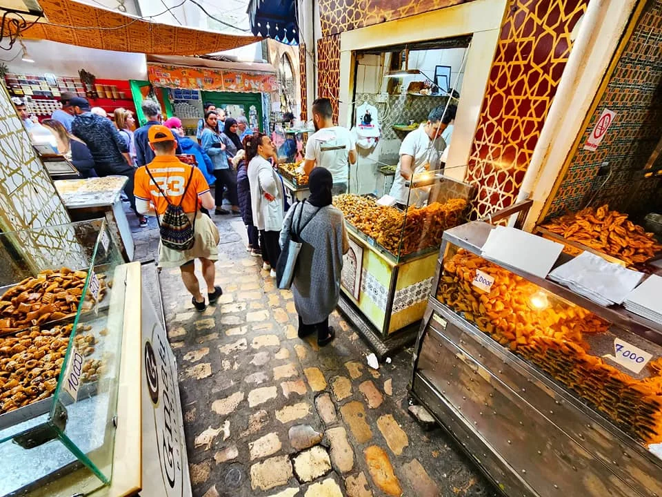 Cruising wiith Danny and Peter, Holland America Line, Nieuw Statendam, La Goulette, Tunis, Tunisia, Exploring Tunisias Cultural Treasures | Nieuw Statendam sails the Mediterranean for Holland America Adventures, docking at La Goulette Port to begin Exploring Tunisia’s Cultural Treasures. Ancient ruins from the Carthage Ruins Tour highlight Historical Sites Tunisia, while Sidi Bou Said Village’s white and blue homes shine as a Mediterranean Cruise Destinations gem. Tunis Medina Markets bustle with spices and Tunisian Artisan Crafts, and vibrant Tunisian cuisine reflects Tunisia Cultural Treasures in North Africa Tourism.