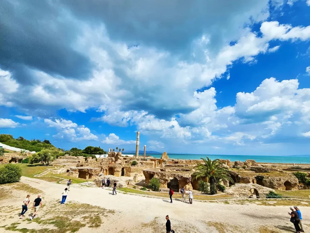 Cruising wiith Danny and Peter, Holland America Line, Nieuw Statendam, La Goulette, Tunis, Tunisia, Exploring Tunisias Cultural Treasures | Nieuw Statendam sails the Mediterranean for Holland America Adventures, docking at La Goulette Port to begin Exploring Tunisia’s Cultural Treasures. Ancient ruins from the Carthage Ruins Tour highlight Historical Sites Tunisia, while Sidi Bou Said Village’s white and blue homes shine as a Mediterranean Cruise Destinations gem. Tunis Medina Markets bustle with spices and Tunisian Artisan Crafts, and vibrant Tunisian cuisine reflects Tunisia Cultural Treasures in North Africa Tourism.