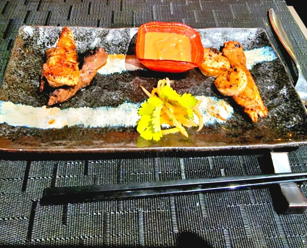 Cruising with Danny and Peter, Holland America Line, Nieuw Statendam, Sea Day | Elegant Gala Dinner at Tamarind on MS Nieuw Statendam featuring luxurious Asian fusion cuisine, exquisite dining setting, and impeccable service aboard a Holland America cruise.