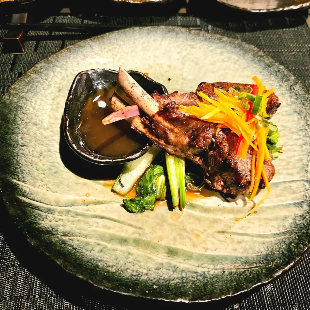 Cruising with Danny and Peter, Holland America Line, Nieuw Statendam, Sea Day | Elegant Gala Dinner at Tamarind on MS Nieuw Statendam featuring luxurious Asian fusion cuisine, exquisite dining setting, and impeccable service aboard a Holland America cruise.