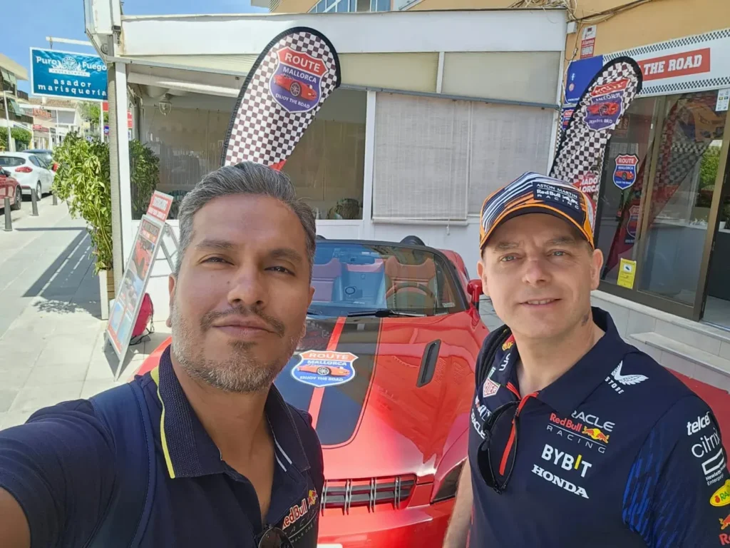 Cruising with Danny and Peter, Holland America Line, Nieuw Statendam, Palma de Mallorca, Spain | Scenic coastal drive in Mallorca during the Palma de Mallorca Sunset Tour, featuring rugged cliffs and azure waters. Historic Palma Cathedral with Gothic architecture is also highlighted. The luxurious seafood feast aboard MS Nieuw Statendam includes lobster, shrimp, and crab, complemented by a stunning Mediterranean sunset with pink and gold hues in the sky.