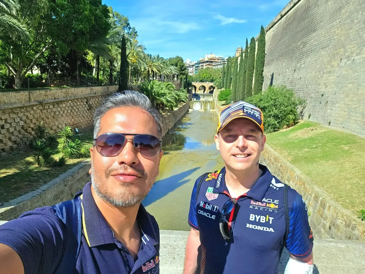 Cruising with Danny and Peter, Holland America Line, Nieuw Statendam, Palma de Mallorca, Spain | Scenic coastal drive in Mallorca during the Palma de Mallorca Sunset Tour, featuring rugged cliffs and azure waters. Historic Palma Cathedral with Gothic architecture is also highlighted. The luxurious seafood feast aboard MS Nieuw Statendam includes lobster, shrimp, and crab, complemented by a stunning Mediterranean sunset with pink and gold hues in the sky.