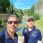 Cruising with Danny and Peter, Holland America Line, Nieuw Statendam, Palma de Mallorca, Spain | Scenic coastal drive in Mallorca during the Palma de Mallorca Sunset Tour, featuring rugged cliffs and azure waters. Historic Palma Cathedral with Gothic architecture is also highlighted. The luxurious seafood feast aboard MS Nieuw Statendam includes lobster, shrimp, and crab, complemented by a stunning Mediterranean sunset with pink and gold hues in the sky.