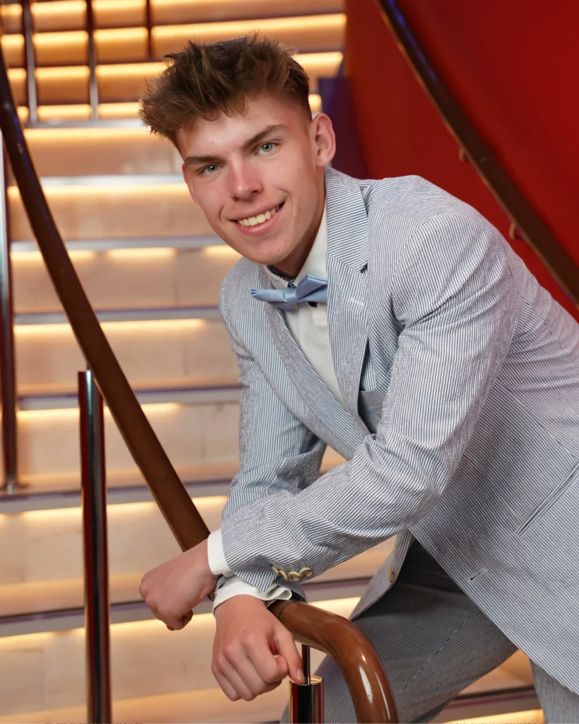 Cruising with Danny and Peter, Holland America Line, Nieuw Statendam, Rotterdam, The Netherlands, Canary Islands Adventure | A vibrant collage captures a family’s adventure on Holland America’s Nieuw Statendam during the Canary Island Enchantment cruise. The journey begins in Rotterdam, Netherlands, with the sleek ship docked against the city’s modern skyline, featuring the Erasmus Bridge. Onboard, the elegant atrium glows with Dutch-inspired decor, while the cozy Oceanview Family Cabin offers serene ocean views. The Lido Pool sparkles under the sun, and the Crow’s Nest provides panoramic vistas. In Agadir, Morocco, vibrant Souk El Had stalls overflow with colorful spices and crafts, and camel rides evoke Berber traditions. Lanzarote’s Cueva de los Verdes showcases dramatic lava tube formations, while Jameos del Agua features a surreal volcanic cave with a turquoise lake. Tenerife’s Anaga Rural Park displays misty laurel forests, and Playa de las Teresitas glows with golden sands. In Funchal, Madeira, a trike tour winds through banana fields, with Cabo Girão’s glass skywalk offering stunning cliff views. Porto’s rainy Ribeira District shines with colorful buildings and azulejo tiles at São Bento Station. In London, a black cab tour passes the iconic Tower Bridge and Buckingham Palace. The cruise ends with a serene sail-away past Dover’s White Cliffs, followed by a heartfelt family reunion in Rotterdam’s Zalmhaventoren apartment, with the city’s skyline in the background.