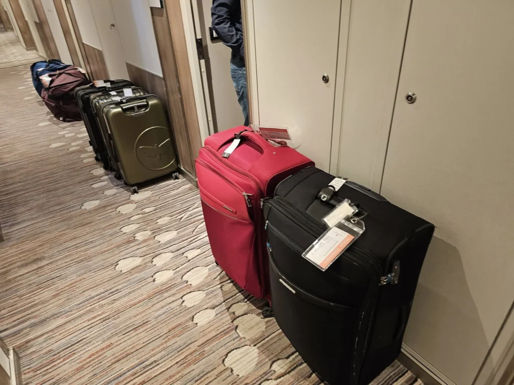 Cruising with Danny and Peter, Holland America Line, Nieuw Statendam, Rotterdam, The Netherlands, Canary Islands Adventure | A vibrant collage captures a family’s adventure on Holland America’s Nieuw Statendam during the Canary Island Enchantment cruise. The journey begins in Rotterdam, Netherlands, with the sleek ship docked against the city’s modern skyline, featuring the Erasmus Bridge. Onboard, the elegant atrium glows with Dutch-inspired decor, while the cozy Oceanview Family Cabin offers serene ocean views. The Lido Pool sparkles under the sun, and the Crow’s Nest provides panoramic vistas. In Agadir, Morocco, vibrant Souk El Had stalls overflow with colorful spices and crafts, and camel rides evoke Berber traditions. Lanzarote’s Cueva de los Verdes showcases dramatic lava tube formations, while Jameos del Agua features a surreal volcanic cave with a turquoise lake. Tenerife’s Anaga Rural Park displays misty laurel forests, and Playa de las Teresitas glows with golden sands. In Funchal, Madeira, a trike tour winds through banana fields, with Cabo Girão’s glass skywalk offering stunning cliff views. Porto’s rainy Ribeira District shines with colorful buildings and azulejo tiles at São Bento Station. In London, a black cab tour passes the iconic Tower Bridge and Buckingham Palace. The cruise ends with a serene sail-away past Dover’s White Cliffs, followed by a heartfelt family reunion in Rotterdam’s Zalmhaventoren apartment, with the city’s skyline in the background.