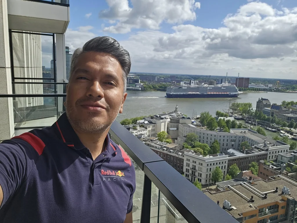 Cruising with Danny and Peter, Holland America Line, Nieuw Statendam, Rotterdam, The Netherlands, Canary Islands Adventure | A vibrant collage captures a family’s adventure on Holland America’s Nieuw Statendam during the Canary Island Enchantment cruise. The journey begins in Rotterdam, Netherlands, with the sleek ship docked against the city’s modern skyline, featuring the Erasmus Bridge. Onboard, the elegant atrium glows with Dutch-inspired decor, while the cozy Oceanview Family Cabin offers serene ocean views. The Lido Pool sparkles under the sun, and the Crow’s Nest provides panoramic vistas. In Agadir, Morocco, vibrant Souk El Had stalls overflow with colorful spices and crafts, and camel rides evoke Berber traditions. Lanzarote’s Cueva de los Verdes showcases dramatic lava tube formations, while Jameos del Agua features a surreal volcanic cave with a turquoise lake. Tenerife’s Anaga Rural Park displays misty laurel forests, and Playa de las Teresitas glows with golden sands. In Funchal, Madeira, a trike tour winds through banana fields, with Cabo Girão’s glass skywalk offering stunning cliff views. Porto’s rainy Ribeira District shines with colorful buildings and azulejo tiles at São Bento Station. In London, a black cab tour passes the iconic Tower Bridge and Buckingham Palace. The cruise ends with a serene sail-away past Dover’s White Cliffs, followed by a heartfelt family reunion in Rotterdam’s Zalmhaventoren apartment, with the city’s skyline in the background.