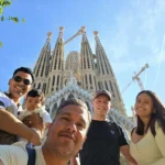 Cruising with Danny and Peter, Holland America Line, Nieuw Statendam, Barcelona, Spain | Family reunion at Barcelona port with loved ones, exploring the Sagrada Familia's stunning facade, enjoying a relaxing Sitges beach day, and dining together on the MS Nieuw Statendam during a memorable Mediterranean family adventure.