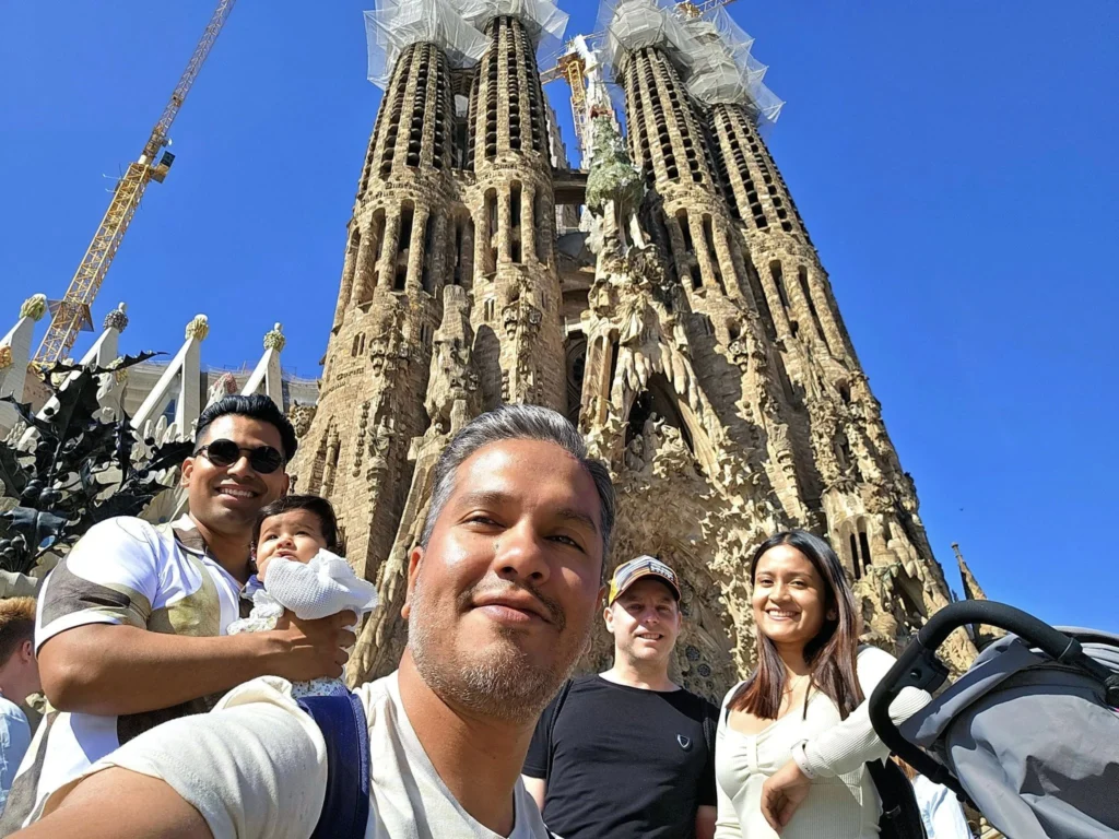 Cruising with Danny and Peter, Holland America Line, Nieuw Statendam, Barcelona, Spain | Family reunion at Barcelona port with loved ones, exploring the Sagrada Familia's stunning facade, enjoying a relaxing Sitges beach day, and dining together on the MS Nieuw Statendam during a memorable Mediterranean family adventure.