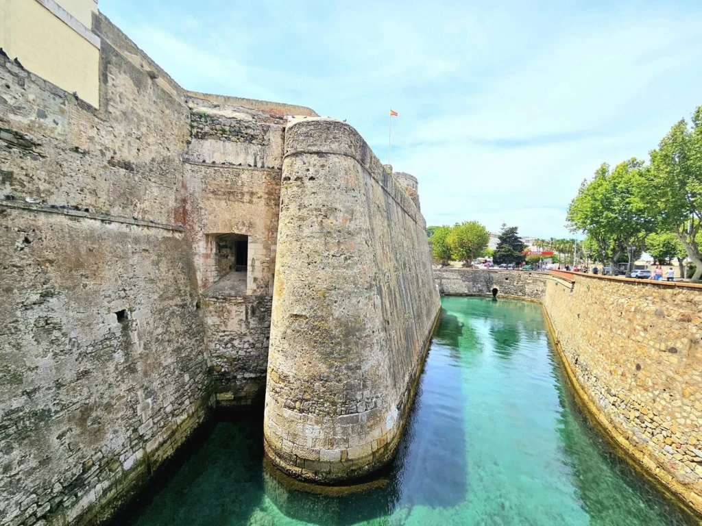 Cruising with Danny and Peter, Holland America Line, Nieuw Statendam, Ceuta, Spanish Morocco, Spain | Travelers on a Ceuta Heritage Tour with Holland America Line explore the historic Royal Walls and enjoy breathtaking panoramic views, while savoring North African dishes at Cafeteria Rotterdam during their Mediterranean culinary journey.