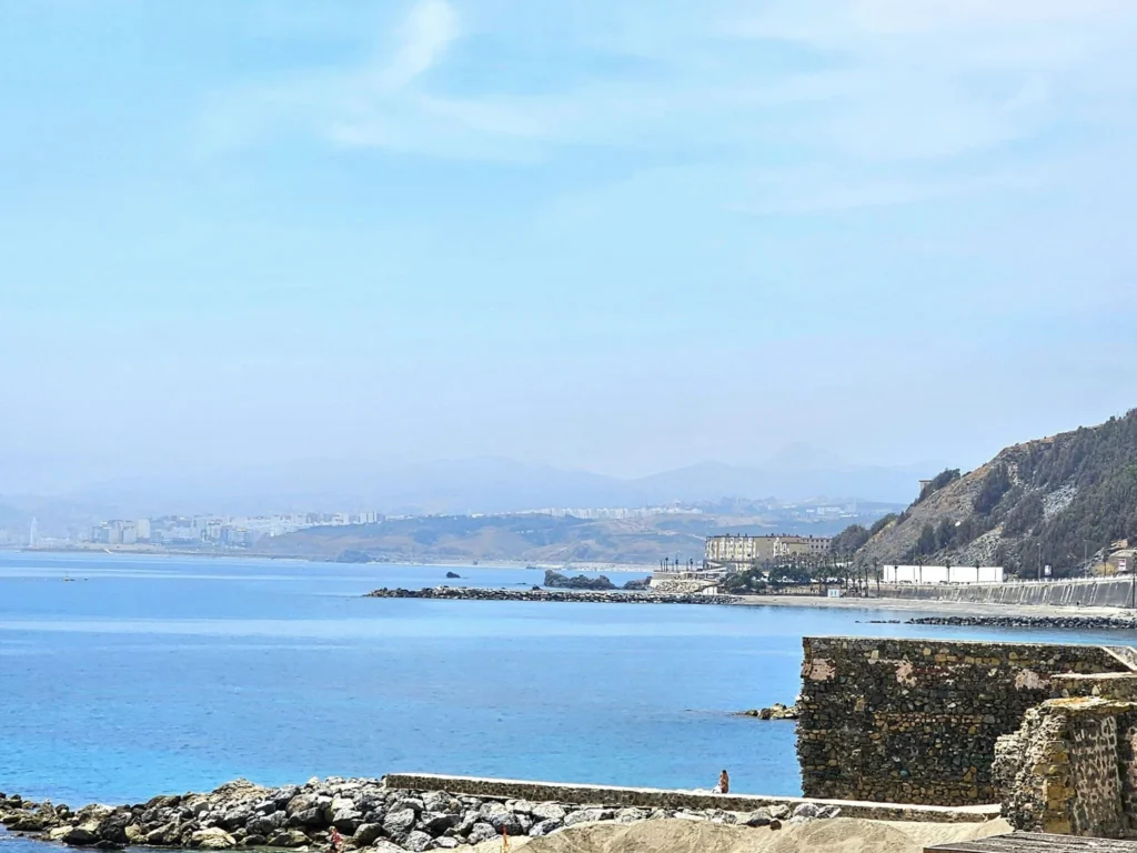 Cruising with Danny and Peter, Holland America Line, Nieuw Statendam, Ceuta, Spanish Morocco, Spain | Travelers on a Ceuta Heritage Tour with Holland America Line explore the historic Royal Walls and enjoy breathtaking panoramic views, while savoring North African dishes at Cafeteria Rotterdam during their Mediterranean culinary journey.