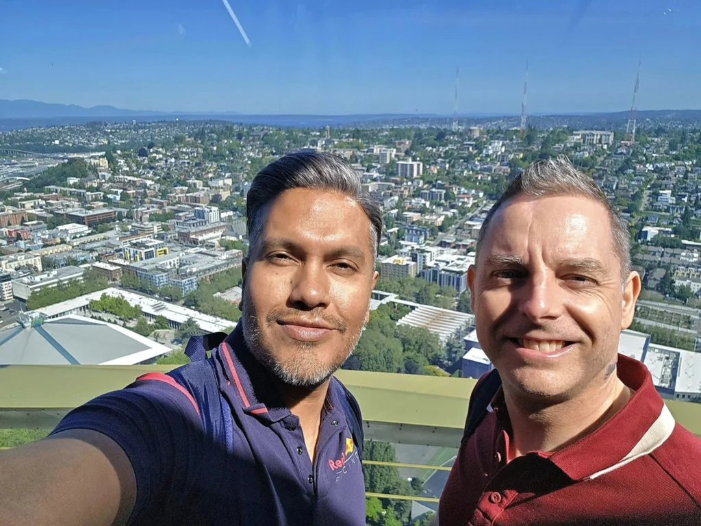 Cruising with Danny and Peter, Holland America Line, Westerdam, Seattle, Washington, United States, Day Trip Arctic Cruise | A vibrant collage capturing a day in Seattle, showcasing Lake Union’s serene waters reflecting the misty skyline with houseboats and kayakers, the towering Space Needle offering panoramic views of Puget Sound and Mount Rainier, and Chihuly Garden and Glass’s colorful glass sculptures blending with lush greenery. Pike Place Market buzzes with vendors tossing salmon and stalls brimming with flowers and artisanal goods under the iconic red sign. A cozy table at Villa Escondida displays tacos al pastor and enchiladas in a warm, mural-lined setting. The Seattle Great Wheel rises above Elliott Bay’s sparkling waterfront, while the Washington Park Arboretum’s tranquil paths feature blooming rhododendrons and a heron by a pond. The Japanese Garden’s koi pond, curved bridge, and stone lanterns create a Zen oasis, all set against Seattle’s dynamic blend of urban and natural beauty.