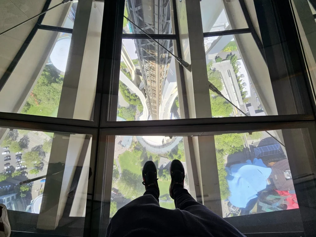 Cruising with Danny and Peter, Holland America Line, Westerdam, Seattle, Washington, United States, Day Trip Arctic Cruise | A vibrant collage capturing a day in Seattle, showcasing Lake Union’s serene waters reflecting the misty skyline with houseboats and kayakers, the towering Space Needle offering panoramic views of Puget Sound and Mount Rainier, and Chihuly Garden and Glass’s colorful glass sculptures blending with lush greenery. Pike Place Market buzzes with vendors tossing salmon and stalls brimming with flowers and artisanal goods under the iconic red sign. A cozy table at Villa Escondida displays tacos al pastor and enchiladas in a warm, mural-lined setting. The Seattle Great Wheel rises above Elliott Bay’s sparkling waterfront, while the Washington Park Arboretum’s tranquil paths feature blooming rhododendrons and a heron by a pond. The Japanese Garden’s koi pond, curved bridge, and stone lanterns create a Zen oasis, all set against Seattle’s dynamic blend of urban and natural beauty.