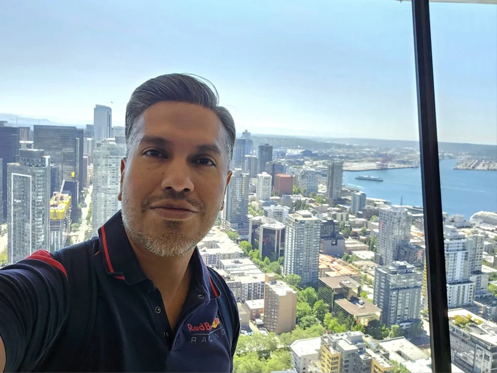 Cruising with Danny and Peter, Holland America Line, Westerdam, Seattle, Washington, United States, Day Trip Arctic Cruise | A vibrant collage capturing a day in Seattle, showcasing Lake Union’s serene waters reflecting the misty skyline with houseboats and kayakers, the towering Space Needle offering panoramic views of Puget Sound and Mount Rainier, and Chihuly Garden and Glass’s colorful glass sculptures blending with lush greenery. Pike Place Market buzzes with vendors tossing salmon and stalls brimming with flowers and artisanal goods under the iconic red sign. A cozy table at Villa Escondida displays tacos al pastor and enchiladas in a warm, mural-lined setting. The Seattle Great Wheel rises above Elliott Bay’s sparkling waterfront, while the Washington Park Arboretum’s tranquil paths feature blooming rhododendrons and a heron by a pond. The Japanese Garden’s koi pond, curved bridge, and stone lanterns create a Zen oasis, all set against Seattle’s dynamic blend of urban and natural beauty.