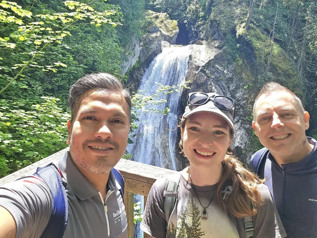 Cruising with Danny and Peter, Holland America Line, Westerdam, Seattle, Washington, United States, Day Trip Waterfalls History | A vibrant collage captures a day in Seattle’s Pacific Northwest Waterfalls Tour, showcasing Pike Place Market’s bustling scene with fishmongers tossing salmon and colorful flower stalls under the iconic red neon sign, set against Puget Sound’s waterfront; Twin Falls cascading over mossy cliffs into a misty pool, surrounded by old-growth evergreens in Olallie State Park, with sunlight filtering through the canopy; North Bend’s retro Twin Peaks diner with its glowing neon sign and quaint main street, framed by rolling hills and the Cascade Mountains; the majestic 270-foot Snoqualmie Falls roaring into a misty pool, with rainbows shimmering in the sunlight and a wooden viewing platform overlooking the lush Snoqualmie Valley; Snoqualmie’s historic district, featuring the Northwest Railway Museum’s vintage locomotives and charming shops lined with old-fashioned street lamps; Borst Lake’s serene waters reflecting Mount Si’s snow-capped peak, with a heron at the edge and evergreen forests under a soft morning mist; and the Museum of Flight’s sleek Concorde and Air Force One jets displayed in a spacious hangar, alongside interactive simulators and a replica of the International Space Station, showcasing Seattle’s aviation heritage.